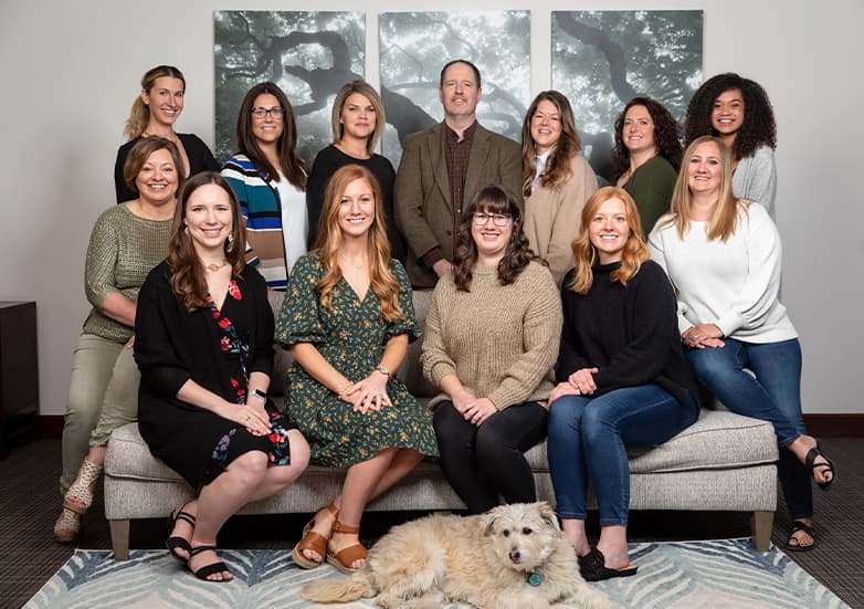 Staff photo including the dog