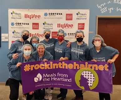 Group of people in hairnets with Meals from the Heartland